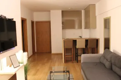 a living room with a couch and a table at WoW APARTMENT'S 604-607 in Budva