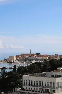 a view of a city with a building and a harbor at WoW APARTMENT'S 604-607 in Budva