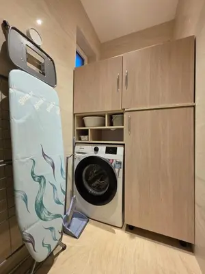 a kitchen with a washer and a washing machine at Peaceful 2bd apartment near Sveti Stefana in Pržno