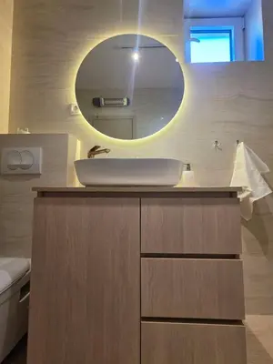 a bathroom with a sink and a mirror at Peaceful 2bd apartment near Sveti Stefana in Pržno