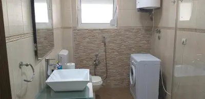 a bathroom with a toilet and a sink and a shower at TALi in Ulcinj