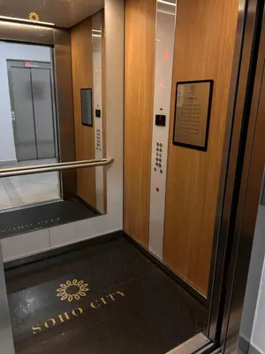 an elevator in a building with a sign on the door at Sea La Vie in Bar