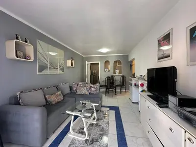 a living room with a couch and a tv at Apartman Nenezic in Budva
