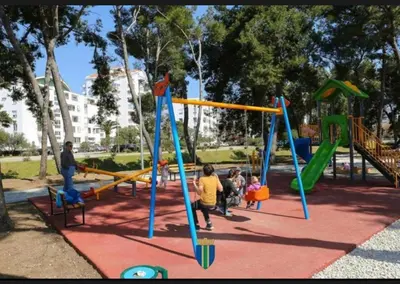a group of children playing on a playground at Sara in Bar