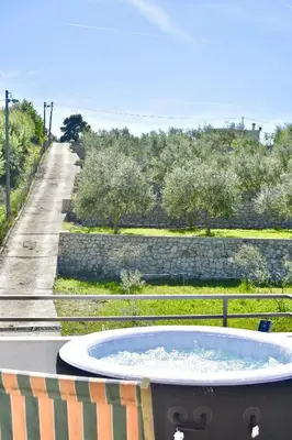 a hot tub on a table with a view of a road at Tiny House with Hot Tub & View in Ulcinj