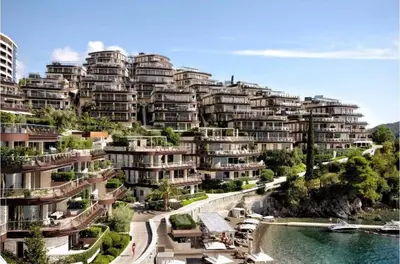 arial view of a large apartment complex with a river at Duklejski pogled in Budva