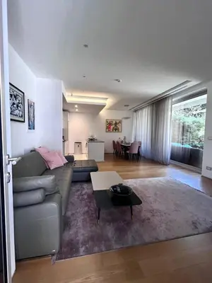 a living room with a couch and a table at Duklejski pogled in Budva