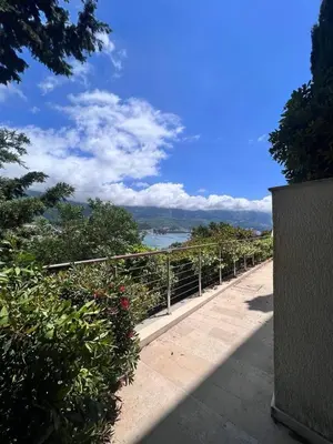 a walkway with a view of a body of water at Duklejski pogled in Budva