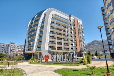 a building with a stop sign in front of it at Studio apartment in Bar