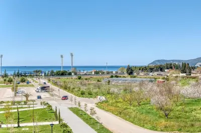 a road in a park with the ocean in the background at Studio apartment in Bar