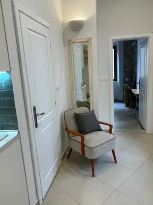 a room with a chair with a pillow on it at Spirit of Kotor in Kotor