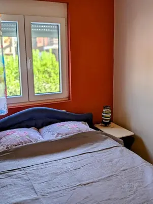 a bedroom with a bed and a window at Sunset Dreams Utjeha in Utjeha