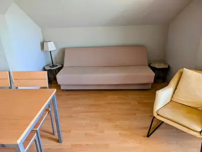 a living room with a couch and two chairs at Sunset Dreams Utjeha in Utjeha