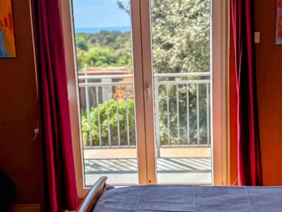 a room with a window with a view of a balcony at Sunset Dreams Utjeha in Utjeha