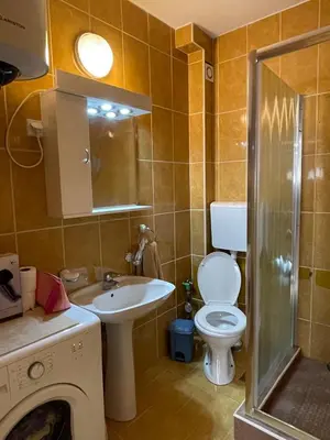 a bathroom with a toilet and a sink and a shower at Two Bedroom Apartment Budva in Budva