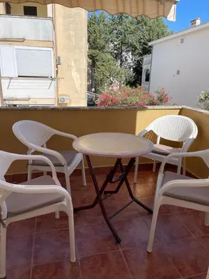 a table and two chairs and a table and chairs at Two Bedroom Apartment Budva in Budva