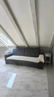 a bedroom with a bed in a attic at Captain Double Suite in Kotor