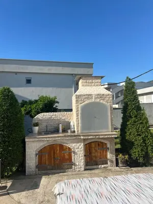 a stone kitchen with a sink in a yard at Casa di Lipa in Bar