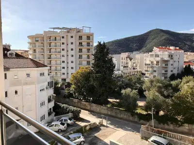 a view of a city with buildings and trees at Apartments Oliva Mare Budva in Budva