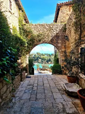 an entrance to a stone building with an archway at Hostel Four Rooms in Ulcinj