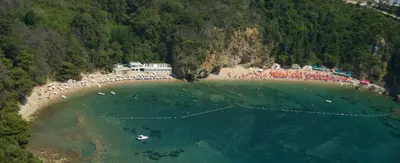an aerial view of a beach with a crowd of people at Apartment Lucky in Budva