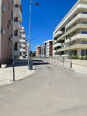 an empty street in a city with tall buildings at New apartment in Ulcinj in Ulcinj