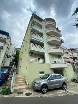 a car parked in front of a building at Quiet Studio Bečići Garage available 5 e per day in Boreti