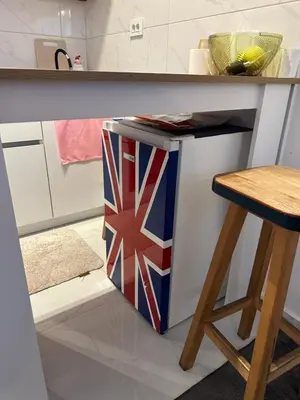 a kitchen counter with a british flag on it at Stex Prime City Kvart in Podgorica