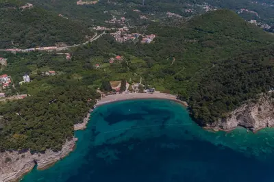 an aerial view of a beach and the ocean at Apartments Fortunella in Petrovac na Moru