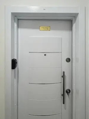 a white door with a sign on top of it at Apartment ENJOY in Bar