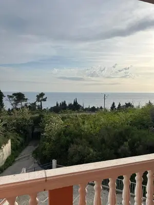 a view of the ocean from a balcony at Benelux Šušanj in Bar