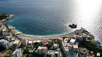 an aerial view of a beach with buildings and the ocean at Villa Radis in Dobra Voda