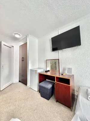 a room with a desk with a computer in it at Hotel Lobo Budva in Budva