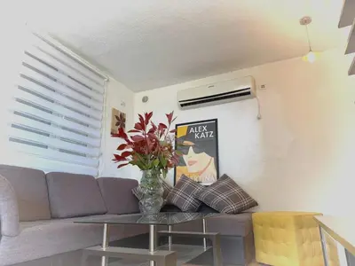 a living room with a couch and a table at AdelFa 2025- Welcome to Rest in Bar