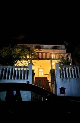 a building with a car in front of it at night at AdelFa 2025- Welcome to Rest in Bar