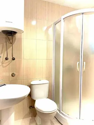 a bathroom with a shower and a toilet and a sink at AdelFa 2025- Welcome to Rest in Bar