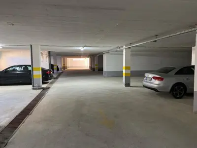 an empty parking garage with cars parked in it at Blue Horizon Apartment in Becici in Budva