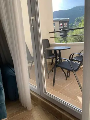 a view of a balcony with a table and chairs at Blue Horizon Apartment in Becici in Budva