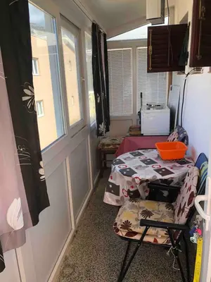 a small room with a table and a window at Apartman ElaBi in Bar