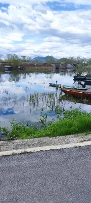 a large body of water with boats in it at Apartments Pajo in Vranjina