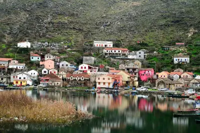 a small town on the shore of a body of water at Apartments Pajo in Vranjina