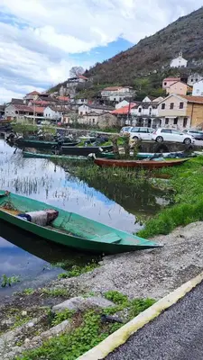 a group of boats are sitting in the water at Apartments Pajo in Vranjina
