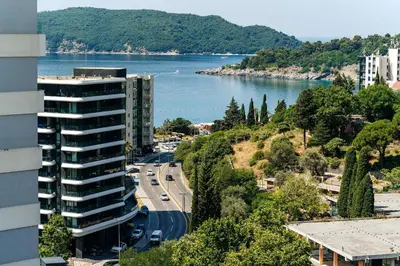 a view of a river and a building and a road at Twin Towers By In Property in Becici