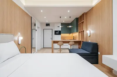 a hotel room with a bed and a desk at Twin Towers By In Property in Becici
