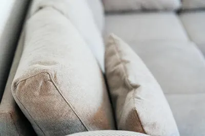 a close up of a couch with two pillows at Twin Towers By In Property in Becici