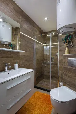 a bathroom with a shower and a toilet and a sink at Montelux Apartments in Budva