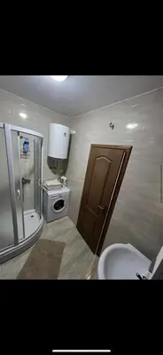 a bathroom with a shower and a toilet and a sink at Stan na dan Bar in Bar, Susanj