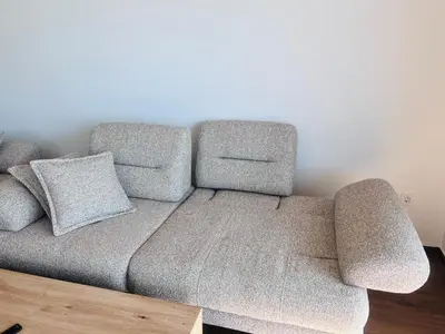 a couch with two pillows on top of it at Swiss DELUXE Appartement in Dobra Voda