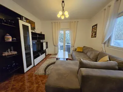 a living room with a couch and a television at Apartment Anna in Polje