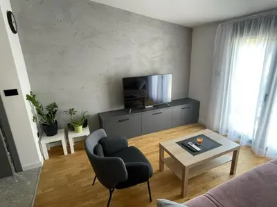 a living room with a couch and a table at Apartment Tara in Podgorica